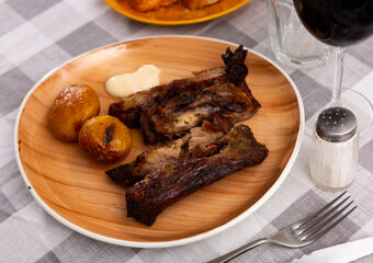 Hearty and satisfying combination of succulent barbecue ribs paired with tender roasted potatoes baked in skins complemented by creamy, garlicky aioli sauce