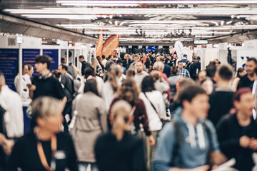 Abstract blurred people at exhibition hall of expo event trade show. Business convention show or...