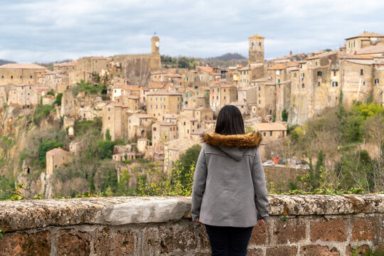 Woman admiring view of ancient town