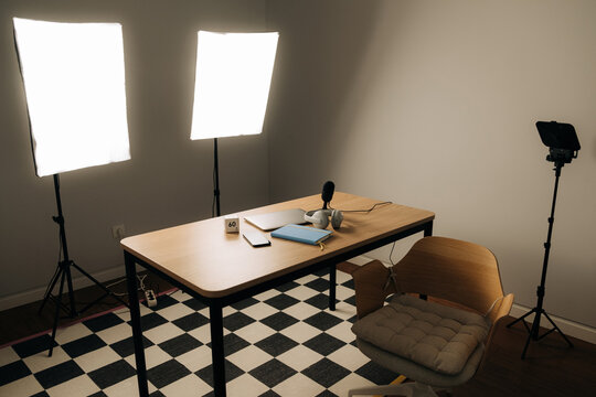 Professional podcast or video recording setup with lighting equi