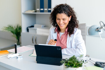 The doctor uses a tablet in the clinic