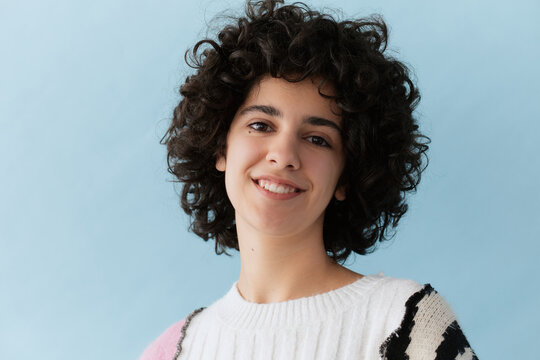 Cheerful gen z woman in sweater
