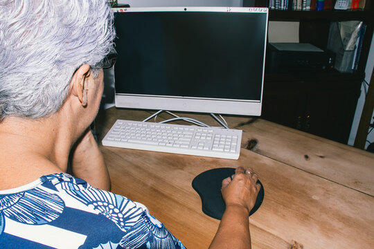Elderly woman working on computer 