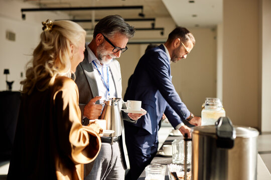 Colleagues chatting on a coffee break