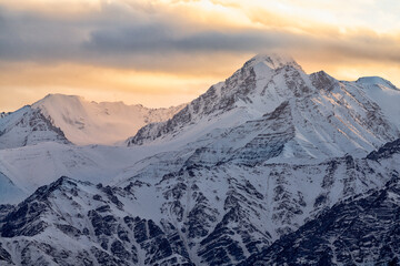 India, Ladakh, Leh, Himalaya Mountains. The mountains around the town of Leh are lit up by the setting sun.