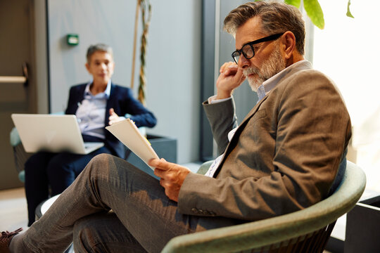 Man and woman doing business in the lobby