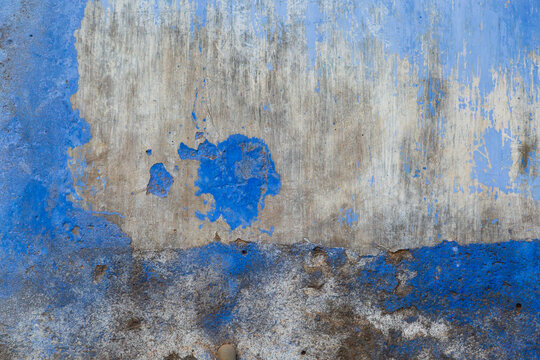 India, North Gujarat. Rabari, Rabbani, Savoda. Peeling blue paint on a wall.