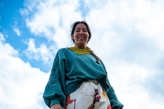 Indigenous woman under sky