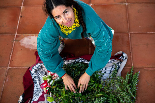 Indigenous woman with herbs