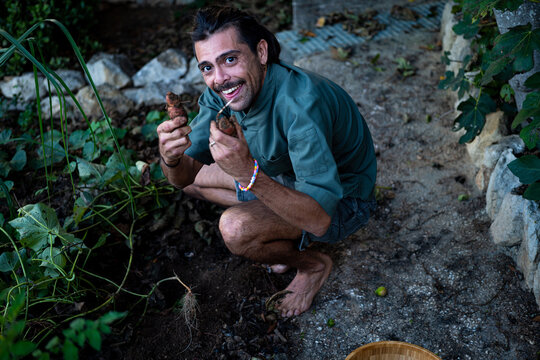 A man digging for vegetables 