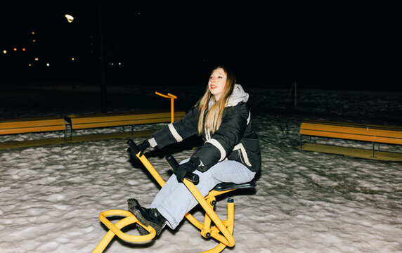Winter night  fun on the yellow street trainer with flash