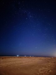 Naklejka premium Starry sky with ships in the background