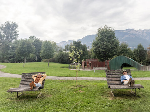 funny image of a couple resting in a public park in the dolomites