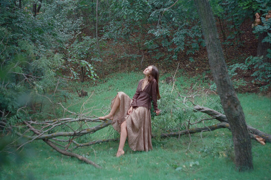young beautiful brunette woman walking in the park