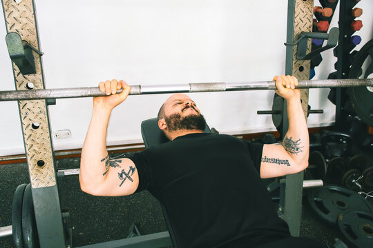 Man lifting weights in the gym 