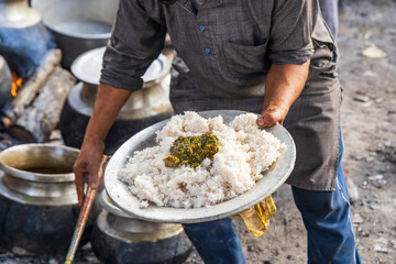 Srinagar, Jammu and Kashmir, India. Preparing food at a wedding.