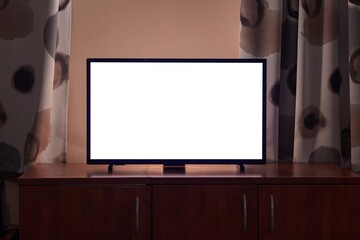 TV in a dim living room, blank screen