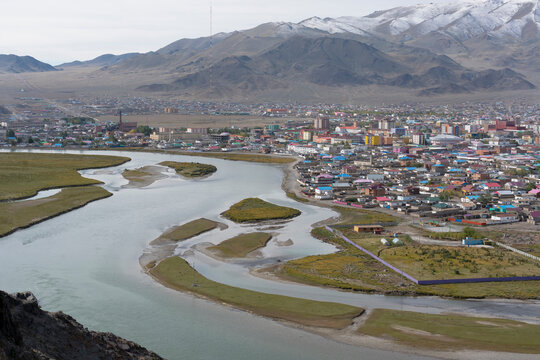 Asia, Mongolia, Bayan-Olgii Province, Olgii, River Khovd. A view of the town of Olgii with the Khovd River flowing through it.