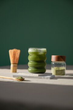 Refreshing Iced Matcha Latte With Traditional Whisk and Powder