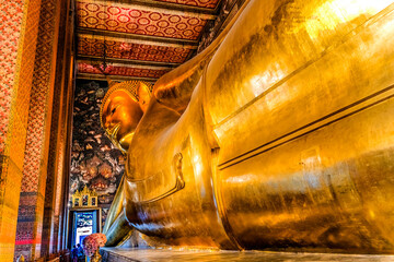 Colorful Reclining Buddha front door, Wat Pho Temple, Bangkok, Thailand. Temple built in 1600's....