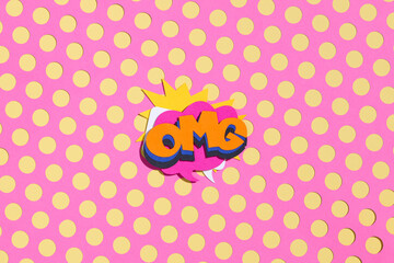 Colorful OMG Text on Pink Polka Dot Background