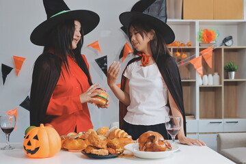 friendship, holiday and people concept - group of happy smiling friends in halloween costumes of...