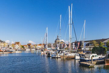 Fototapeta premium Netherlands, North Holland, Enkhuizen. Pleasure boats on a Dutch canal.