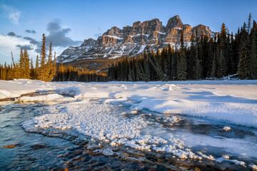 Canada, Alberta, Banff National Park. Bow River meanders past Castle Mountain in winter