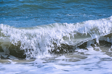 Crashing waves with spray and foam.