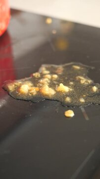 Dirty stovetop with garlic and oil