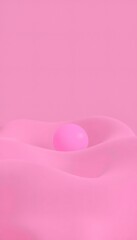 Pink sphere on a pink wavy surface.