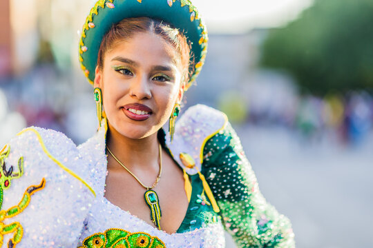 Hispanic woman wearing traditional Caporales Bolivia dress celebrating Dia de la hispanidad