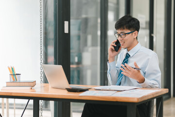 Business professional manages financial stress while engaging in serious phone conversation
