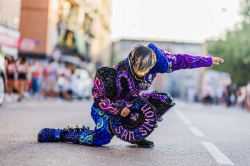Dancer wearing elaborate costume performing during hispanic day parade. Dia de la hispanidad