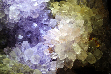 Close up of a group of colorful crystals on a black background
