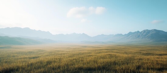 Fototapeta premium Serene landscape Misty mountains and golden field under a clear sky.