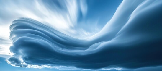 Dramatic, swirling, blue sky cloudscape.