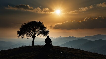 Fototapeta premium Silhouette of a human pray to the Allah on hill