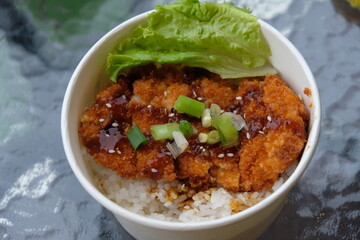 chicken katsu rice bowl. Chicken Katsu also known as panko chicken or tori katsu is a Japanese dish, consisting of fried chicken made with panko bread crumbs. Japanese food.