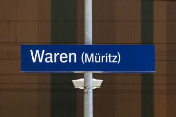 Waren (M&uuml;ritz) sign of the train station in Germany. Location name of the travel destination in Mecklenburg-Western Pomerania. Railroad platform of the public transportation service.
