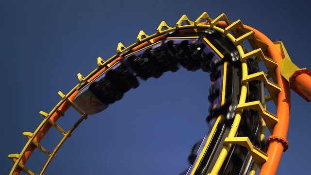 Roller coaster Ride against Roller coaster in the amusement park.