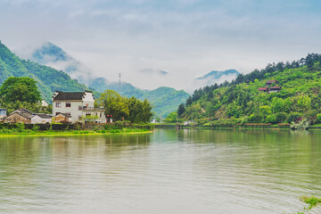 Fototapeta premium Tourism Scenery of Ancient Towns, Ancient Buildings, and Rivers in the Mountainous Areas of Anhui Province, China On April 22, 2024
