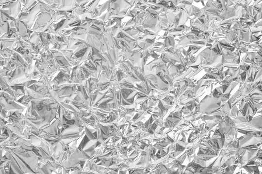 Silver foil leaf shiny texture, abstract grey wrapping paper for background and design art work.