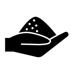 Salt in hand icon in glyph style