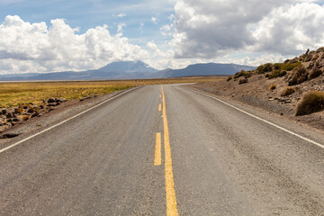 Landscape of road between mountains in the Peruvian desert in Arequipa. Concept of travel and freedom.