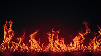Fototapeta premium Fire abstract background concept. Bright flames glowing against a dark background, creating a dramatic fire effect.