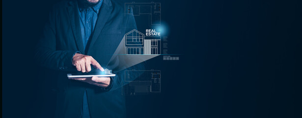 A businessman professional using a tablet to visualize architectural designs real estate,...