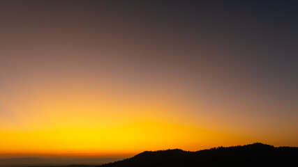 Fototapeta premium Enjoy a panoramic view of the skyline. The sun rises in the morning sky with colorful clouds. and beautiful cloud patterns In the soft light of the morning 