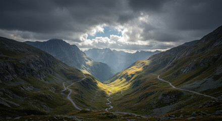 A high-altitude mountain pass under dramatic storm clouds, with patches of sunlight breaking through to highlight the rocky terrain
