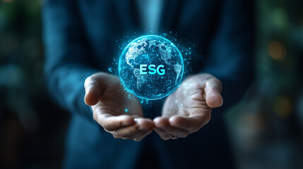 Fototapeta premium businessman holding circular ESG icon, circular economy concept for future business growth and environmental sustainability and reduce pollution for future business and environmental growth
